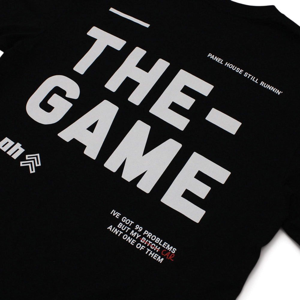 Panel House Merch Still Runnin' THE GAME T-Shirt - Black With Grey Letters