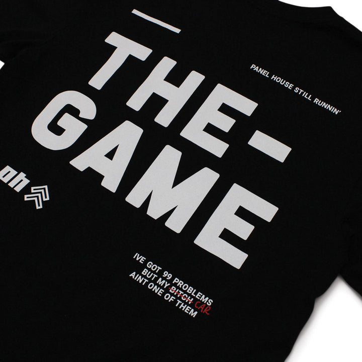 Panel House Merch Still Runnin' THE GAME T-Shirt - Black With Yellow Letters
